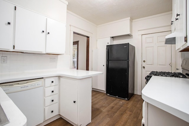 kitchen featuring dark wood-type flooring, range, black refrigerator, white cabinetry, and white dishwasher