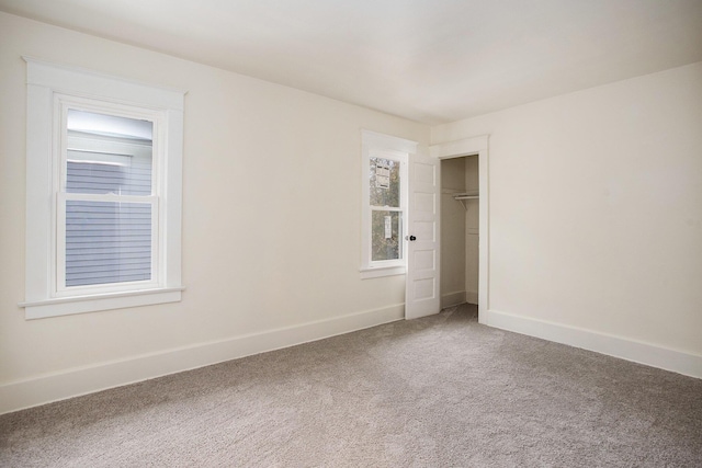 unfurnished bedroom featuring a closet and carpet flooring