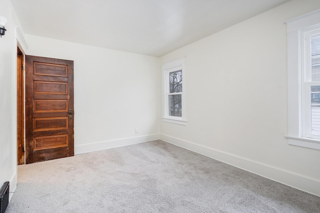 unfurnished room featuring carpet floors