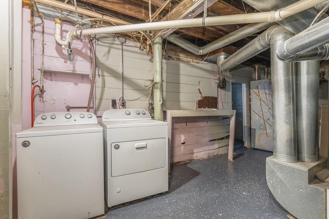 laundry area featuring washing machine and clothes dryer