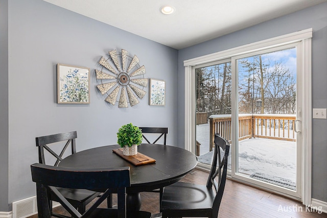 dining area featuring hardwood / wood-style floors