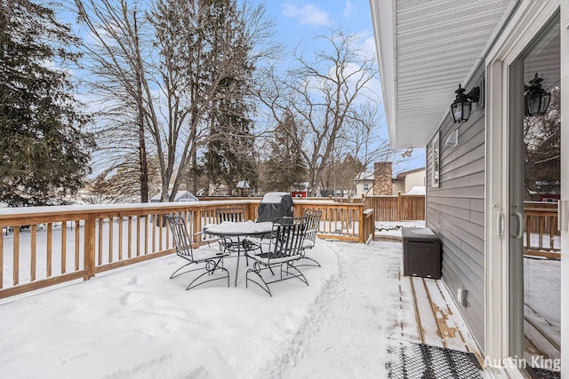 view of snow covered deck