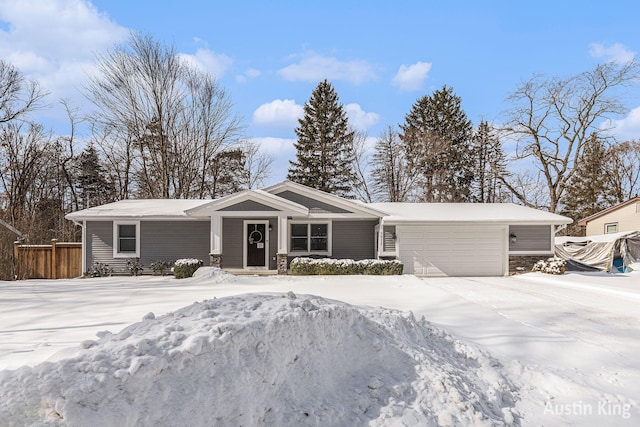 single story home featuring a garage