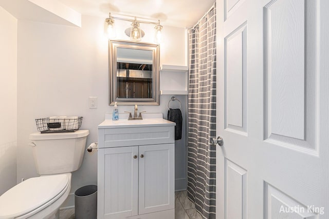 bathroom with toilet and vanity