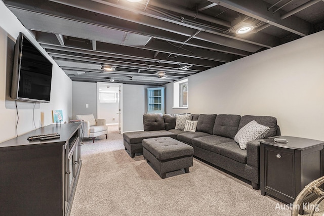 living room featuring light carpet and a wealth of natural light