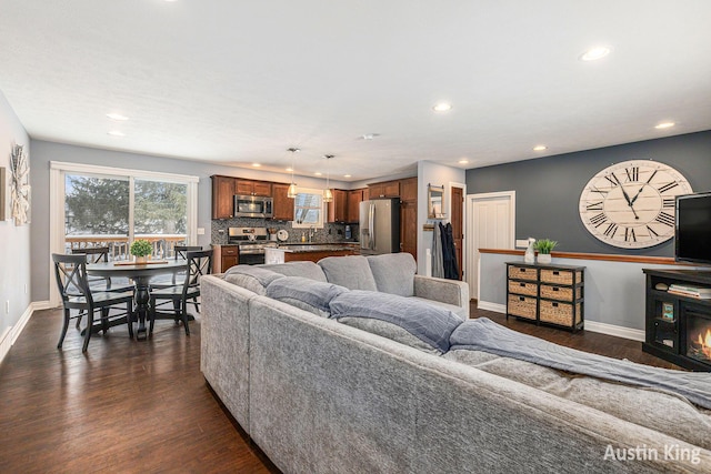 living room with dark hardwood / wood-style floors