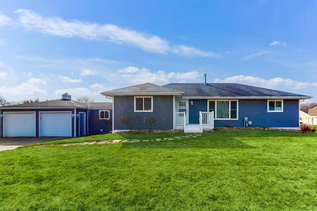 ranch-style home featuring a garage and a front lawn