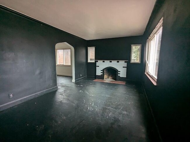 unfurnished living room with plenty of natural light