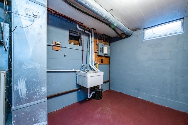 basement featuring sink and electric panel