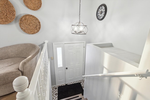 foyer entrance featuring an inviting chandelier