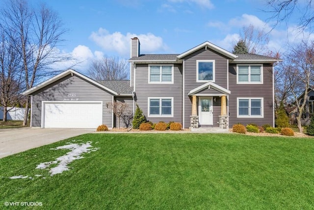 view of front of house featuring a garage and a front yard