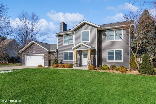 view of front of property with a garage and a front yard