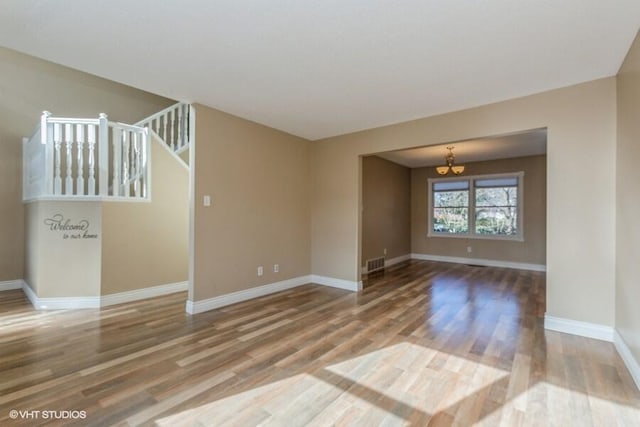 unfurnished room featuring hardwood / wood-style floors