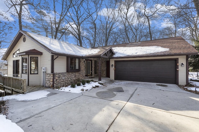 ranch-style house featuring a garage