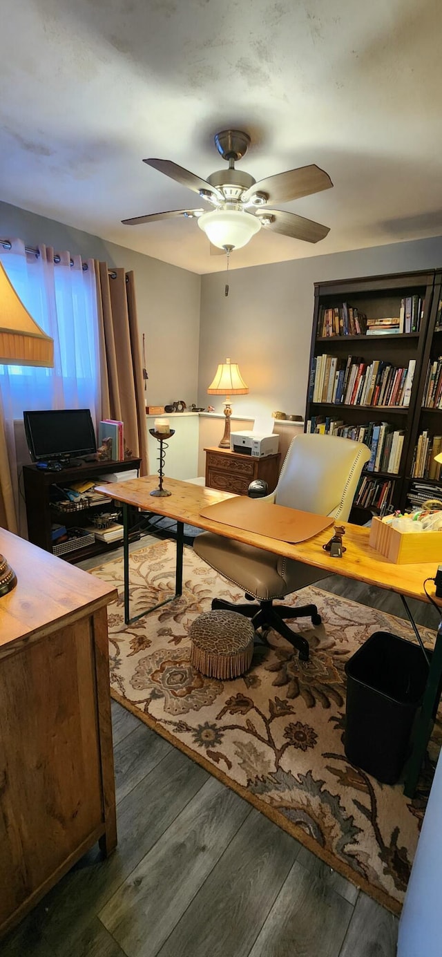 office area with dark hardwood / wood-style floors and ceiling fan