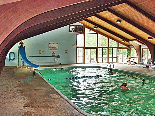 view of swimming pool with a water slide