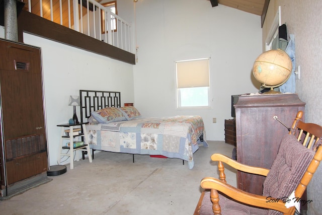 bedroom featuring high vaulted ceiling