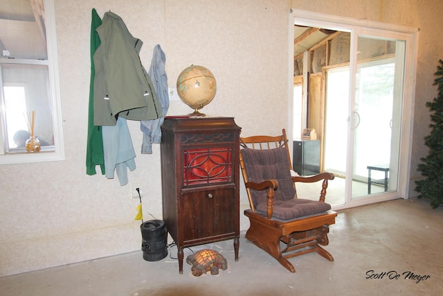 sitting room featuring concrete floors