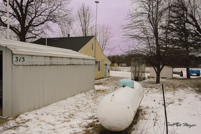 view of yard layered in snow