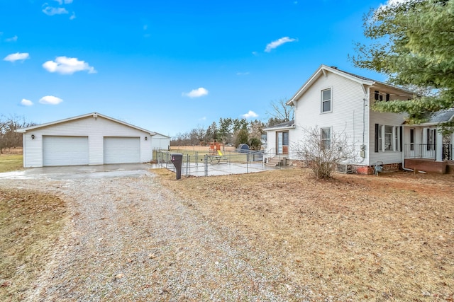 view of side of home with an outbuilding and a garage