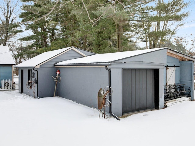 view of snow covered garage