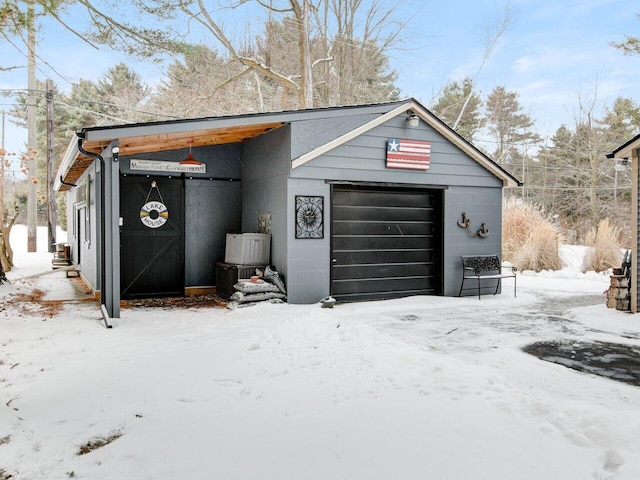 view of snow covered garage