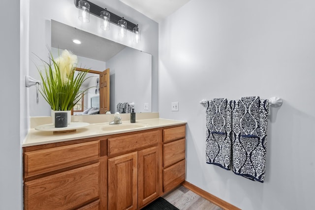 bathroom featuring vanity and wood-type flooring