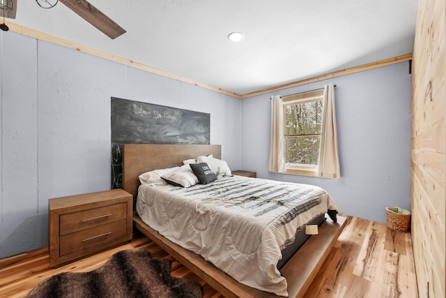 bedroom with hardwood / wood-style floors