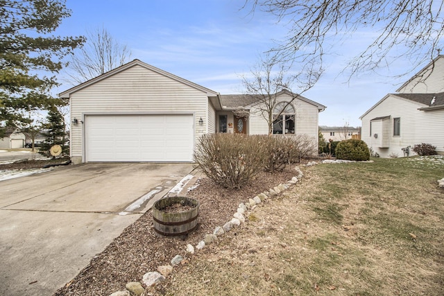 view of front of house with a garage and a front lawn