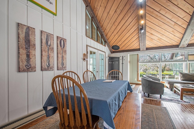 dining space with baseboard heating, wood ceiling, wood finished floors, high vaulted ceiling, and beamed ceiling