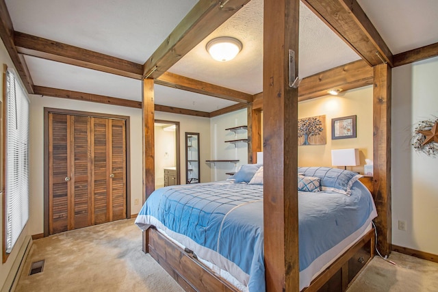 bedroom with carpet floors, visible vents, and beam ceiling