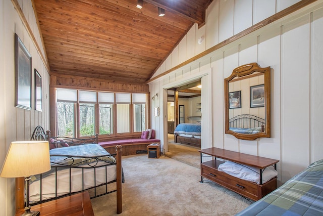 carpeted bedroom with lofted ceiling with beams, wooden ceiling, and wooden walls