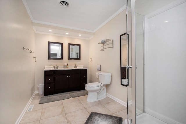 bathroom with toilet, crown molding, visible vents, and a sink