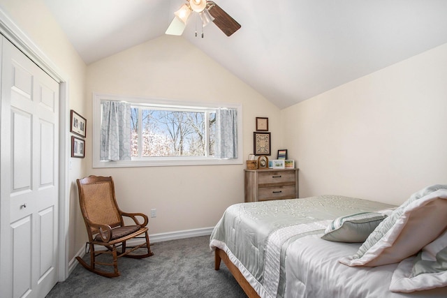 carpeted bedroom featuring lofted ceiling, baseboards, and a ceiling fan