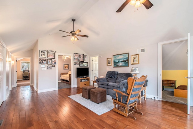 living room with baseboards, visible vents, a ceiling fan, hardwood / wood-style flooring, and high vaulted ceiling