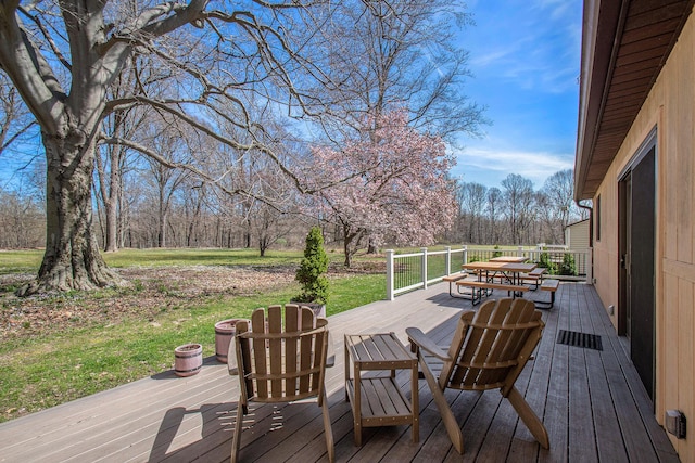 wooden terrace featuring outdoor dining space