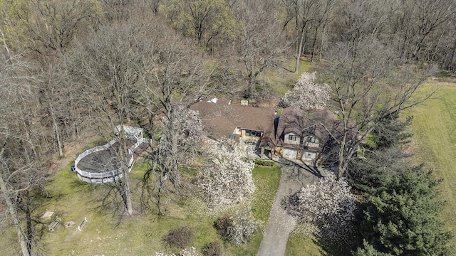 birds eye view of property with a wooded view