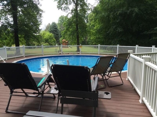 view of pool with a fenced in pool
