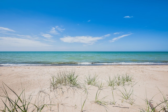 property view of water featuring a beach view