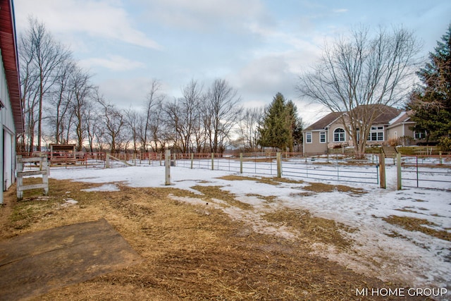 view of yard layered in snow