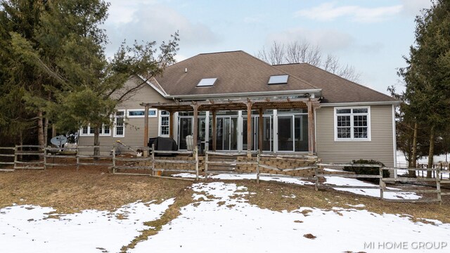 view of snow covered house