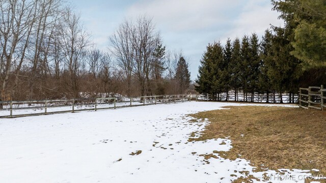 view of yard layered in snow