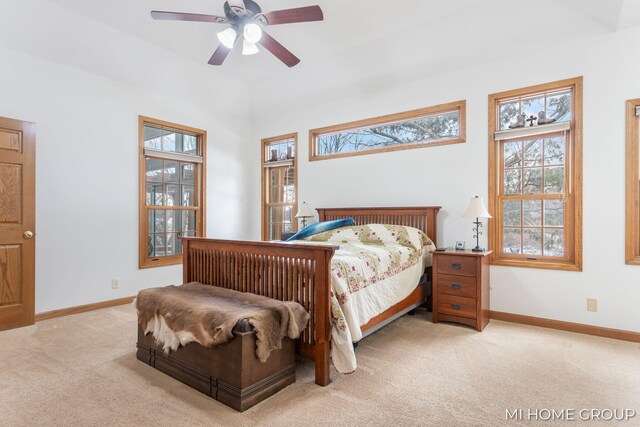 bedroom featuring ceiling fan and light colored carpet