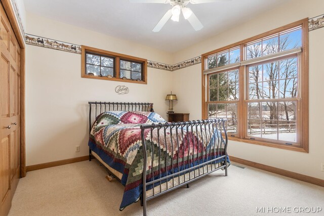 carpeted bedroom featuring ceiling fan