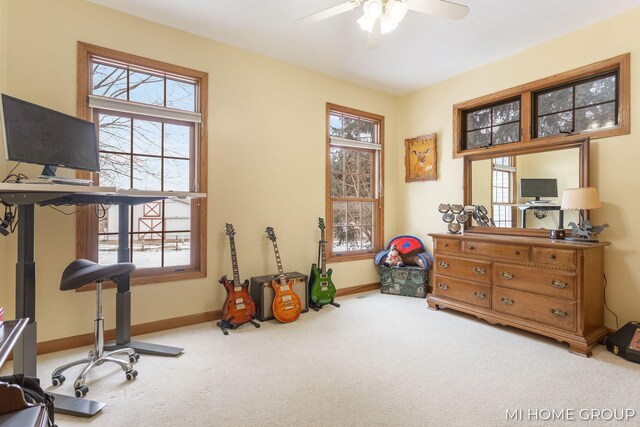 exercise area with light carpet and ceiling fan