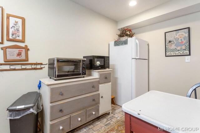 kitchen featuring white refrigerator