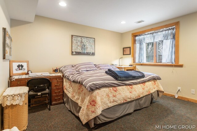 bedroom featuring dark carpet