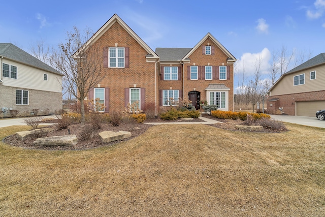 view of front of house featuring brick siding and a front lawn