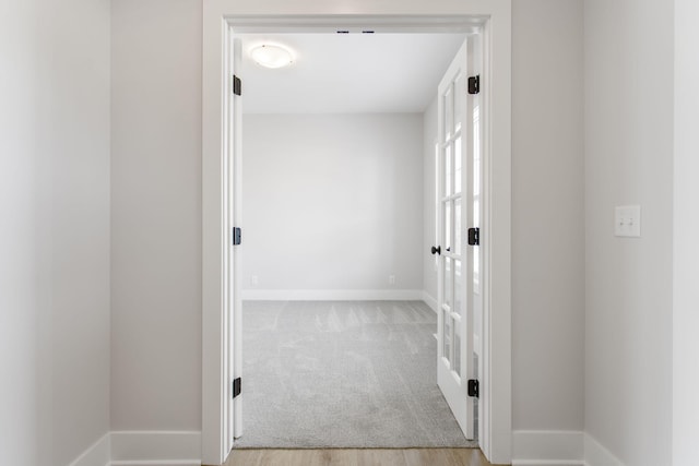 hallway with light carpet