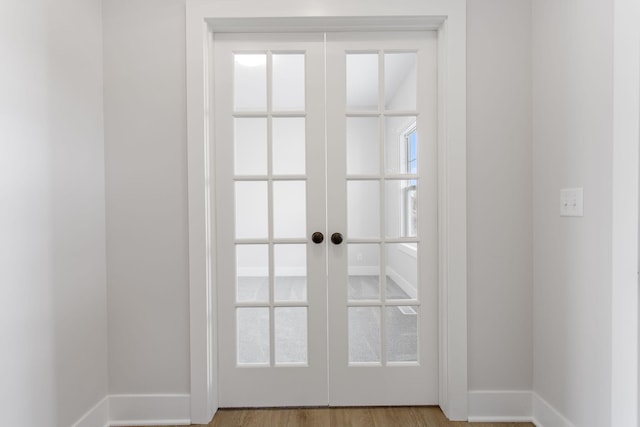 doorway to outside featuring light wood-type flooring and french doors